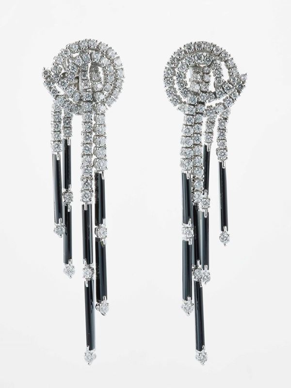 Pair of diamond and onix pendant earrings