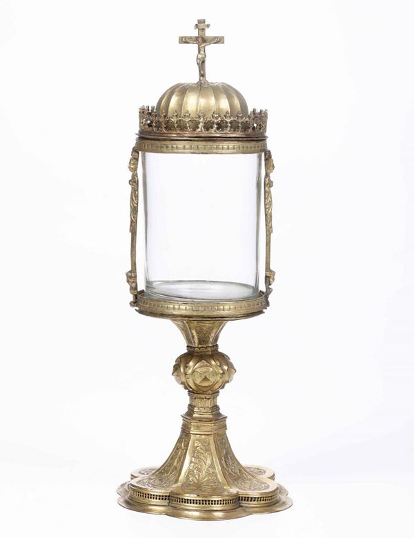 Reliquario. Rame sbalzato, cesellato e dorato. Cilindro in vetro (non coevo). Oreficeria rinascimentale italiana, inizi XVI secolo