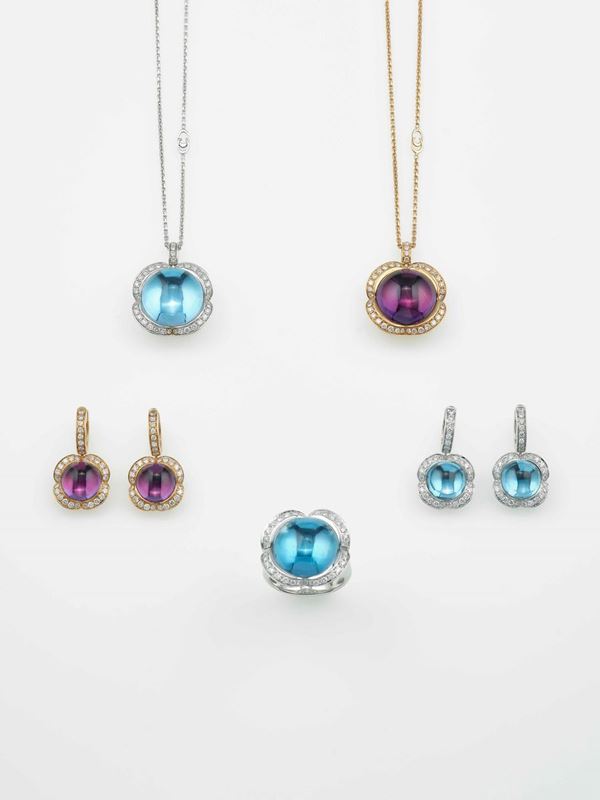 Modello Diva. Lotto composto da due pendenti, tre paia di orecchini e due anelli con ametiste, topazi azzurri e diamanti
