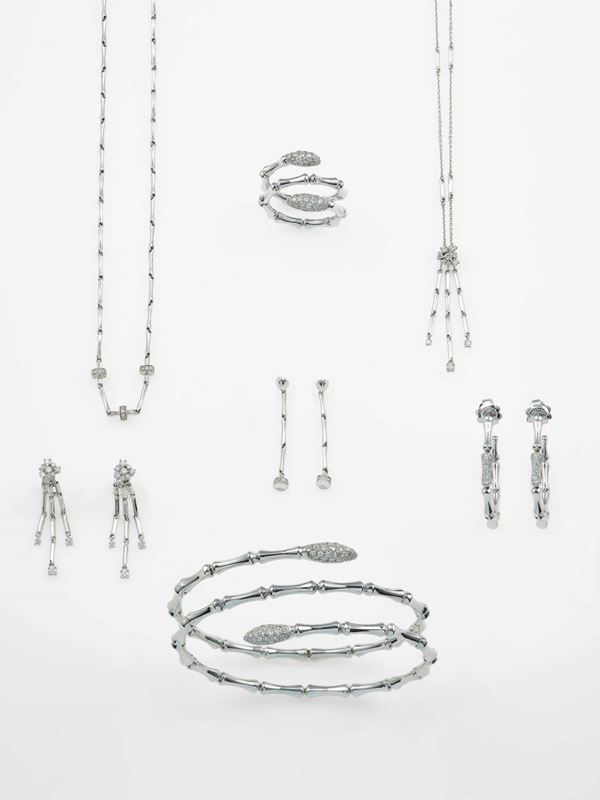 Group of three pairs of earrings, teo necklaces, one ring and one bangle necklace