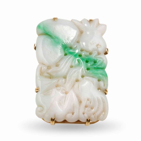 Carved jade and gold brooch