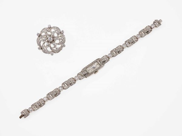 Diamond, platinum and gold lady's wristwatch and brooch